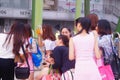 Young Chinese women play and take photos