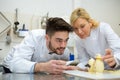 young chocolatier decorating egg chocolate