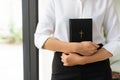 young christian girl holding bible in hand Read the Bible in the house. Concept for Faith, Royalty Free Stock Photo