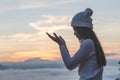 Young christian woman hands open palm up worship and praying to god at sunrise, Christian Religion concept background Royalty Free Stock Photo