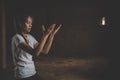 Young christian woman hands open palm up worship and praying to god at sunrise, Christian Religion concept background