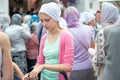 Young christian woman in white headscarf. Russia