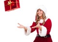 Young Christmas Woman is catching an xmas present Royalty Free Stock Photo