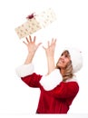 Young Christmas Woman is catching an xmas present Royalty Free Stock Photo