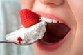 Break the Diet. Chubby girl sitting at kitchen table eating cake mouth close-up Royalty Free Stock Photo