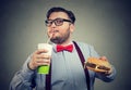 Excited overweight man eating fast food Royalty Free Stock Photo