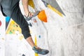 Young climber climbing on the boulder wall indoor, rear view, concept of extreme sports and bouldering Royalty Free Stock Photo