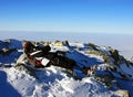 Young climber resting on top of Peleaga peak, Romania Royalty Free Stock Photo