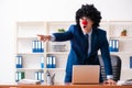 Young clown businessman working in the office Royalty Free Stock Photo