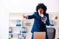 The young clown businessman working in the office Royalty Free Stock Photo