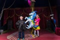 Young Clowns on Stage with Balloons