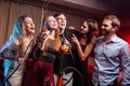 Young clubbers spend time in karaoke bar