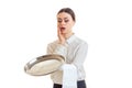 A young clumsy waitress drops on the floor round tray for Cookware Royalty Free Stock Photo
