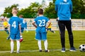 Young Coach Coaching Junior Soccer Team