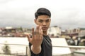 A young cocky man makes a taunt gesture while doing boxing, mma or other combat sport drills. Daring you to come over here and get Royalty Free Stock Photo