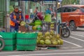 A young coconut seller without masker is peeling coconuts on a hot day, in the area around Simpang Lima, Boyolali City. BOYOLALI