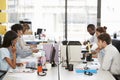 Young colleagues working in a busy open plan office Royalty Free Stock Photo