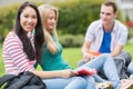 Young college students sitting in the park Royalty Free Stock Photo