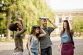 Young college students walking with books on their heads. Royalty Free Stock Photo