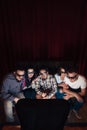 Young company in 3d glasses watch tv, top view