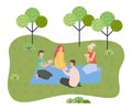 Young group of friends on a picnic outside the city, sitting on grass, palying cards. Green spaces