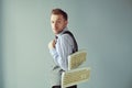 Young computer geek carrying keyboards underhand