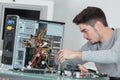 Young computer repairman at work Royalty Free Stock Photo