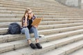 Young student girl making notes in notebook Royalty Free Stock Photo