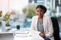 Young, confident and ambitious business woman and corporate professional looking happy, positive and smiling in her Royalty Free Stock Photo