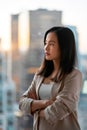 Young confident Asian business woman executive looking at window thinking. Royalty Free Stock Photo