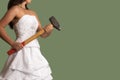 Young confident bride with a sledgehammer