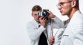 young confident brothers. confident model photographer. twins brother in white. photographing Royalty Free Stock Photo