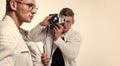 young confident brothers. confident model photographer. twins brother in white. photographing