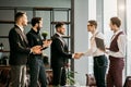 Business people shaking hands to each other Royalty Free Stock Photo