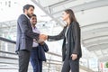 Young confident business people shaking hands, concept business, relationship,successfulness etc