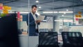 Young Confident Businessman Using Laptop Computer in Modern Office. Stylish Manager in a Suit Royalty Free Stock Photo