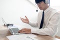 Young confident male call center operator customer service representative doing his job on the phone with headset Royalty Free Stock Photo