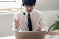 Young confident male call center operator customer service representative doing his job on the phone with headset Royalty Free Stock Photo