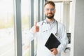 Young and confident male doctor portrait. Successful doctor career concept Royalty Free Stock Photo