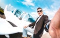 Young confident man taking selfie with mobile smart phone at private airplane - Modern business concept with rich guy ready for Royalty Free Stock Photo