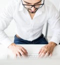 Young confident man working in modern office full