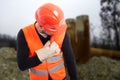 Young construction worker having chest pain