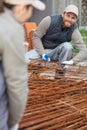 young construction worker laying foundations Royalty Free Stock Photo