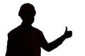 Young construction worker silhouette in hard hat showing thumbs up class sign on white isolated studio background