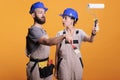 Young construction workers posing with painting tools Royalty Free Stock Photo