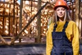 young constructor engineer female in New residential construction home framing