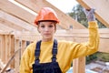 young constructor engineer woman in New residential construction home framing