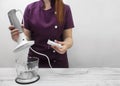 A cook woman assembling a blender