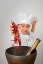 Young cooks or chef child are cooking