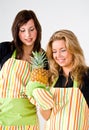 Young cooks with pineapple Royalty Free Stock Photo